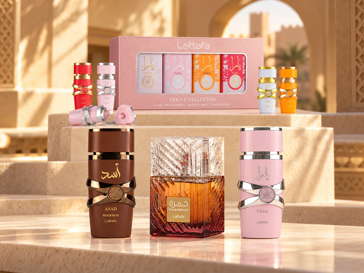 Coffret Éclat : la Yara Collection et ses quatre miniatures, Asad Bourbon, Khamrah et Yara en 100 ml, sur des marches de pierre claire au soleil.